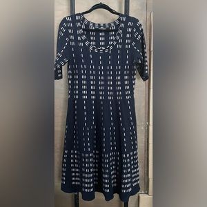 Navy Sweater Dress with tan and white details.